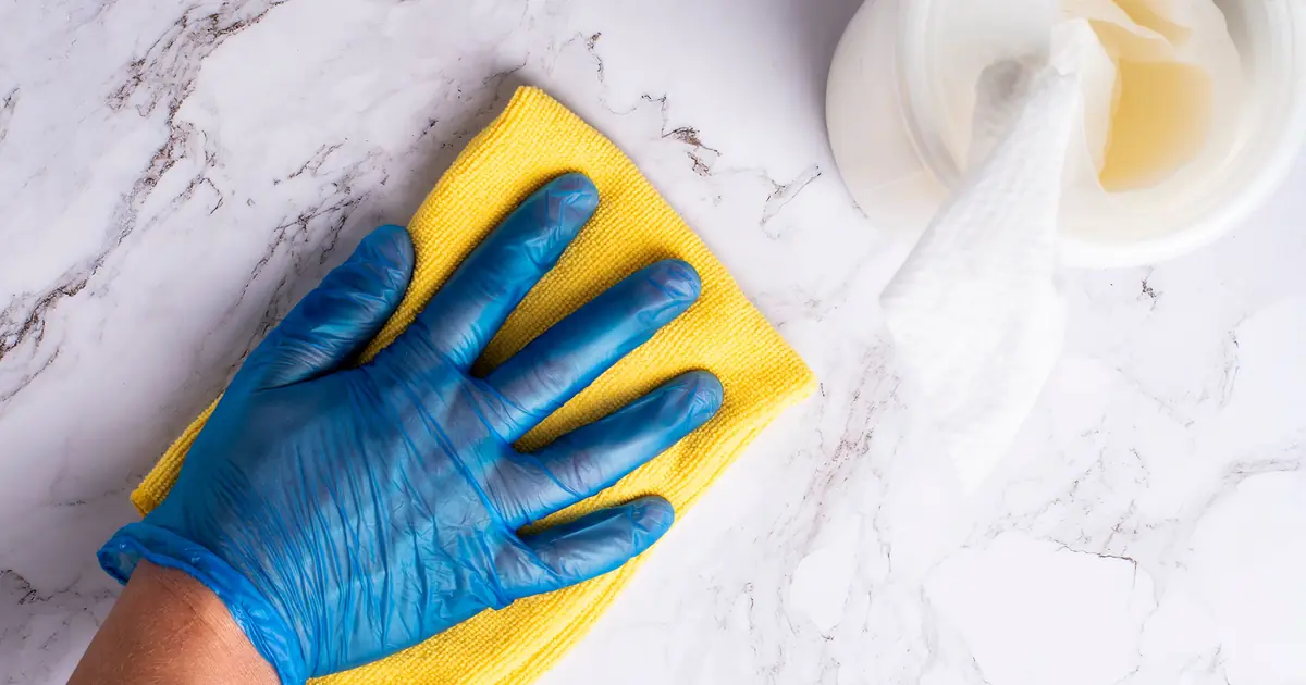 wiping a cat's fur with a cloth