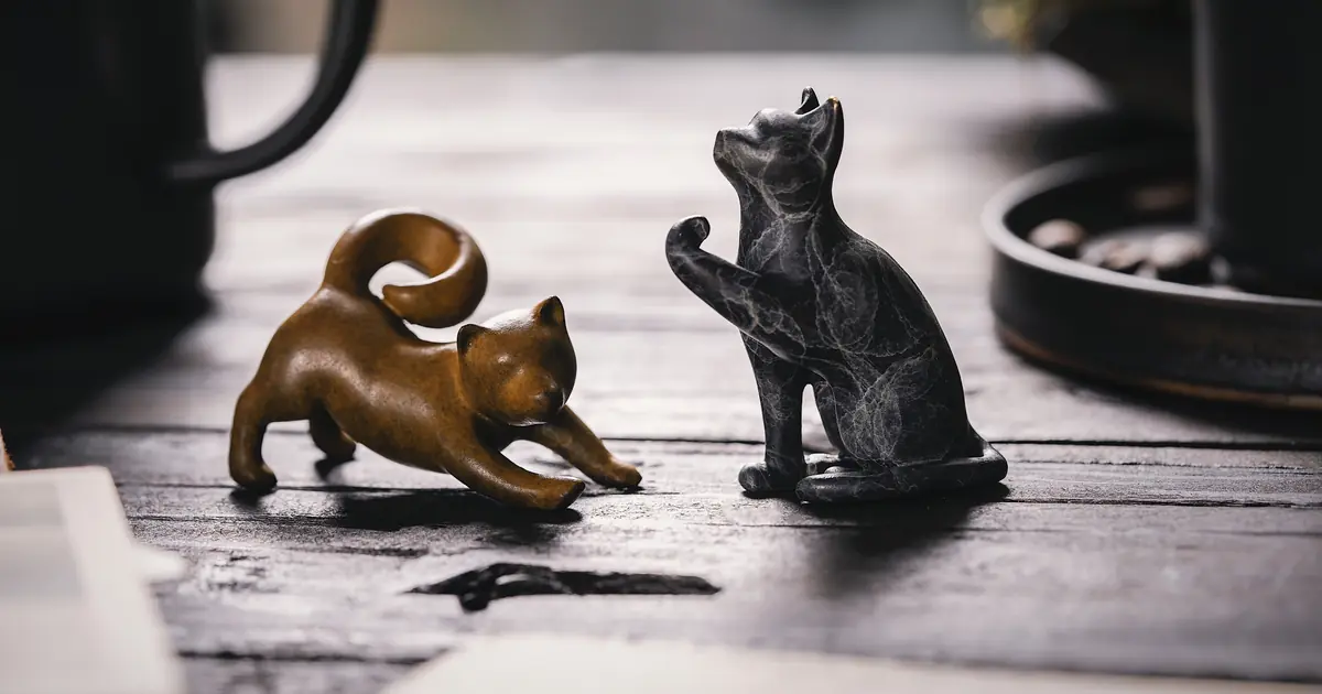 why do cats knock things over