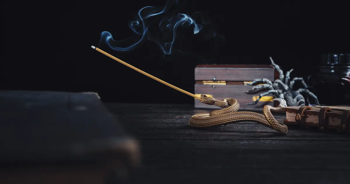 burning incense with smoke