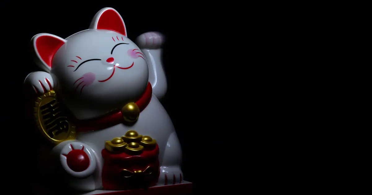 the maneki-neko beckoning cat is a symbol of good luck
