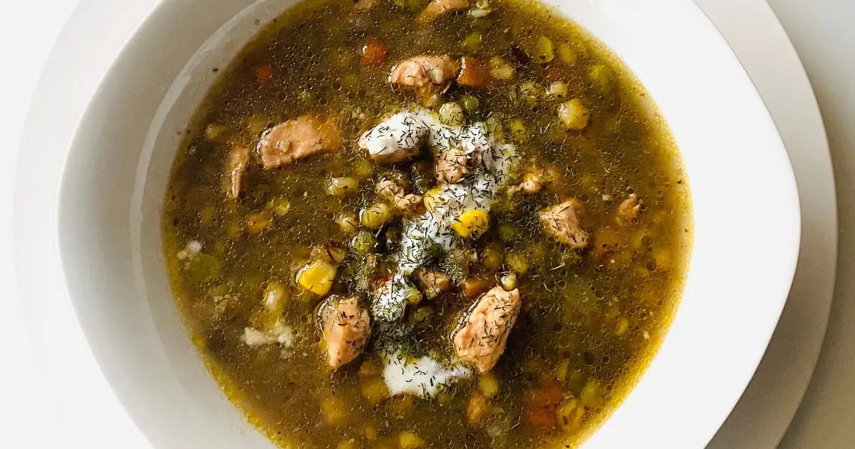 wet cat food in broth in a bowl